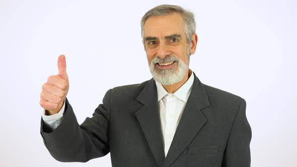 An Elderly Man Smiles and Shows a Thumb Up To the Camera - White Screen Studio