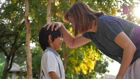 Asian Mother  Saying Goodbye To Her Son As He Leave For School,Back To School Concept Slow Motion 2