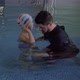 Rehabilitation Centre Evexia, small boy and teacher in swimming pool - VideoHive Item for Sale