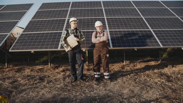 Portrait of Successful Factory Managers Stand at Solar Batteries