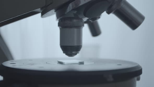 Closeup of a Microscope Setup Over a Glass Slide
