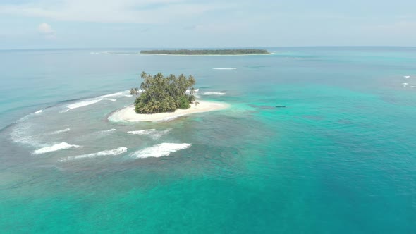 Aerial: flying over tropical island white beach caribbean sea turquoise water co