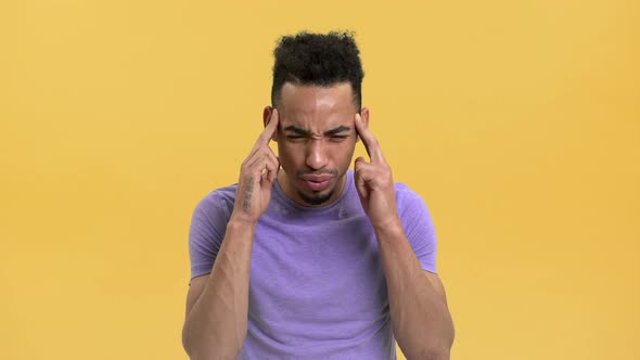 Portrait of Arabic Young Man Rubbing Temples Having Headache or Suffering From Migraine Isolated