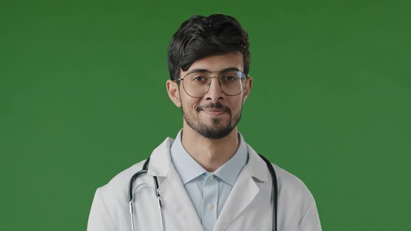Portrait of Smiling Arab Guy Pharmacist Therapist Professional Physician Doctor Wears White Coat