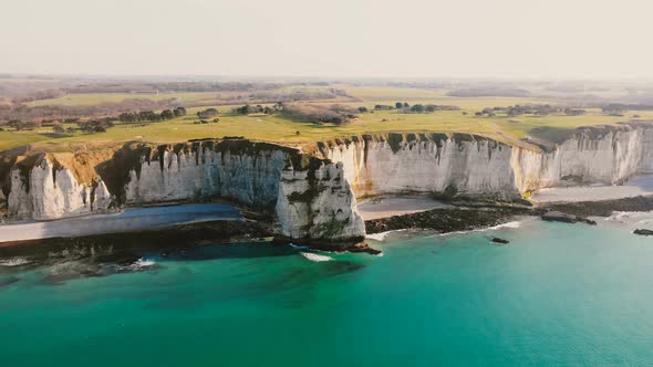 Drone Is Slowly Approaching Epic Sunset White Chalk Cliffs and Green Fields Above Azure Sea