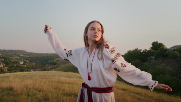 Happy Young Woman Enjoying the Sunset Wearing Traditional Ukrainian Clothes