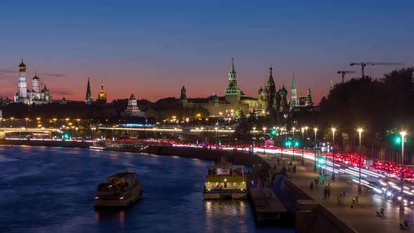 Saint Basil Cathedral and Moscow Kremlin on background of sunset with night traffic