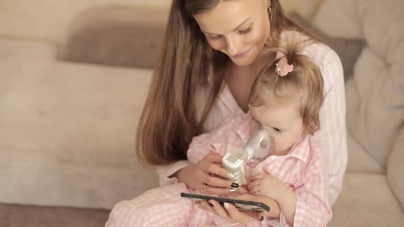 Mother Curing Little Daughter and Caring About Health