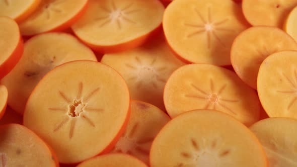 Slices of ripe orange persimmon