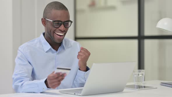 Successful Online Shopping By African Man Laptop