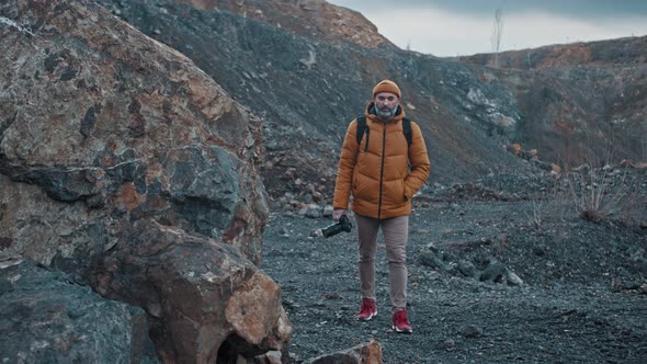 Traveler Photographing Scenic View in Mountains