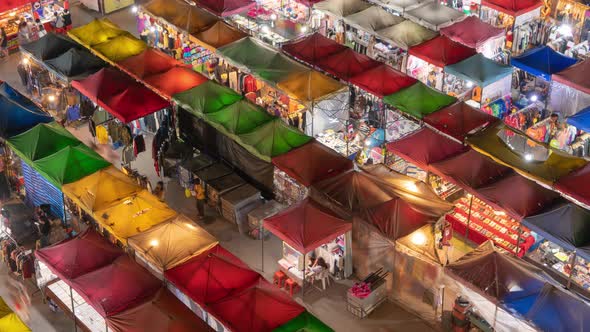 Time lapse of aerial top view of Night Market people walking street