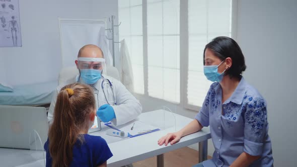 Doctor Showing Skeleton on Tablet