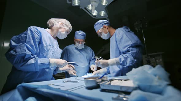 Surgeons Performing Operative Procedure on Patient