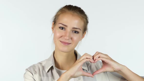 Young Girl Showing Heart Made by hands