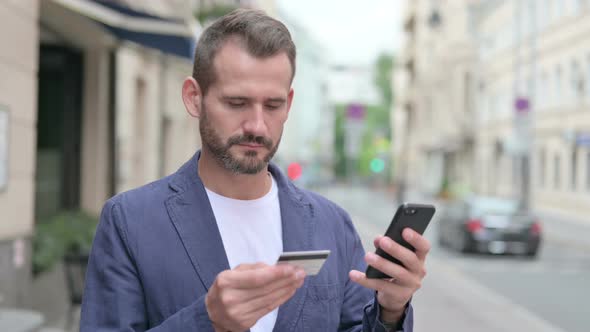 Mature Adult Man Having Online Payment Failure on Smartphone