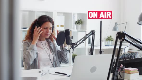 Woman Finishing Work in Broadcast Studio