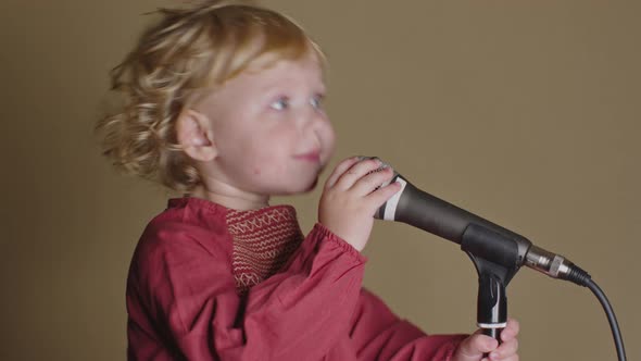 Cute Little Girl Sing Song Into Microphone, Funny Toddler Enjoing Broadcasting