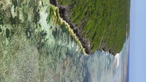 Vertical Video of Low Tide in the Ocean Near the Coast of Zanzibar Tanzania Aerial View