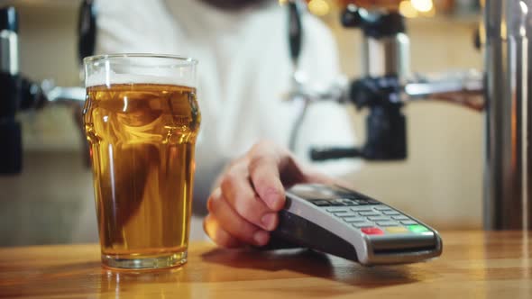 Buying Beer and Paying By Phone with Blue Screen Chroma Key Closeup