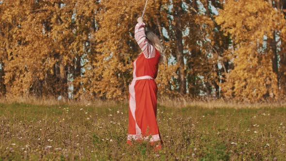 Medieval Concept - Woman in Red National Long Dress Masterfully Wields Two Swords