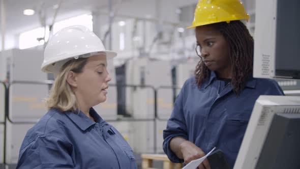 Black Female Engineer Showing How New Machine Working