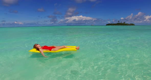 Beautiful lady and man on honeymoon vacation enjoy life on beach on clean white sand background 