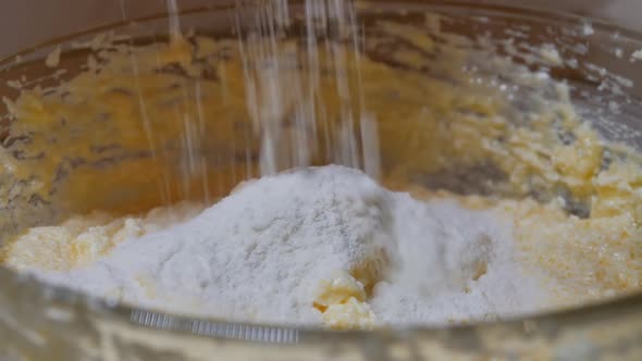 Add Flour with Dry Ingredients to the Bowl with the Dough for Mixing with a Mixer at Low Speed