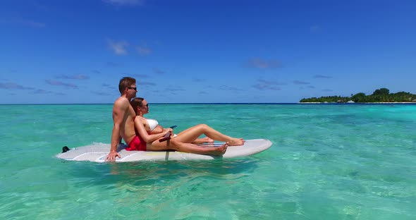 Fun lady and man in love dating on vacation enjoy luxury on beach on sunny white sandy background 