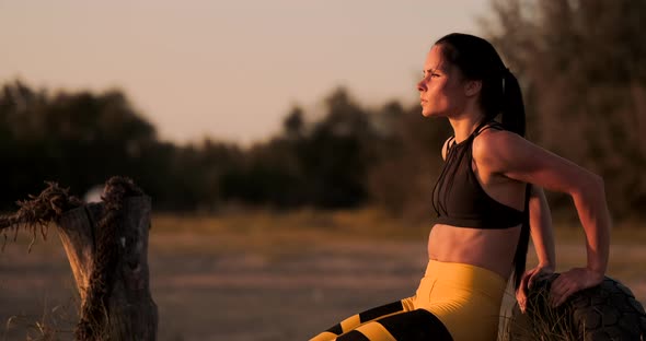 Female Athlete Doing Push Ups On Beach