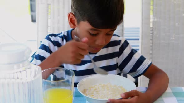 Boy having breakfast 4k