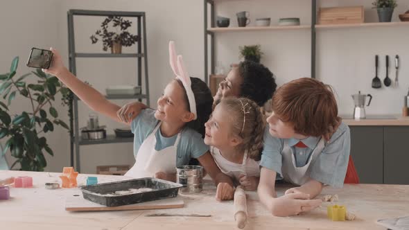 Children Taking Selfie in Kitchen alt