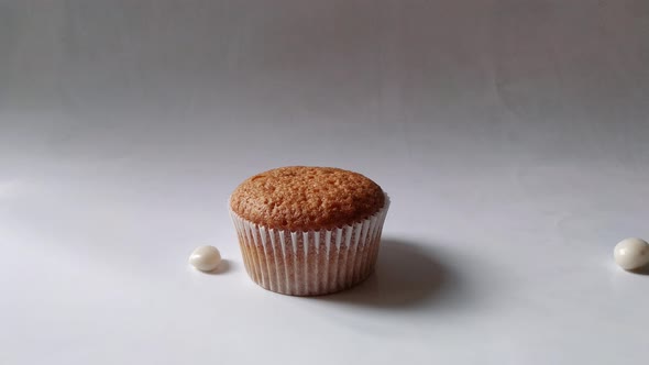 Cupcake with Heart on a Stick on White Background alt