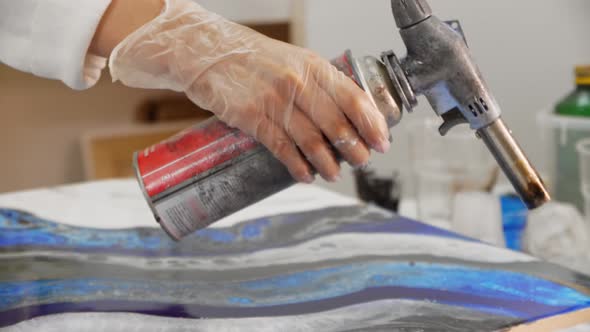 Using a Burner for a Painting Made of Epoxy Resin