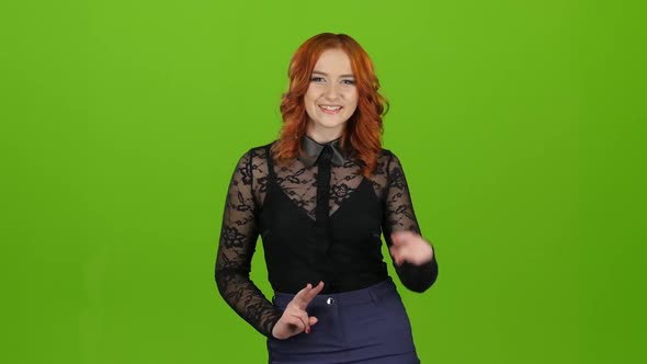 Redhaired Girl Begins To Dance, She Is in a Good Mood. Green Screen