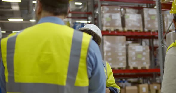 Afro Female Manager Giving Tour Business People to Inspect Factory Warehouse