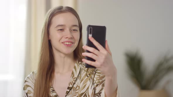 Cheerful Girl Talking on Video Call on Mobile Phone