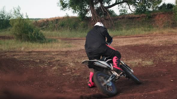 Man in Helmet Skidding on Motorcycle