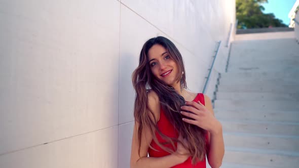 Beautiful Woman in Red Elegant Dress, Urban White Background