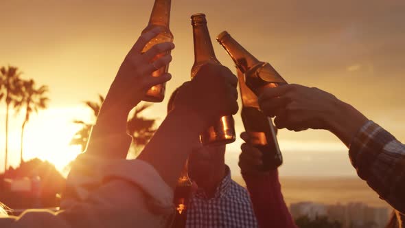 Group of friends drinking a beer on a rooftop