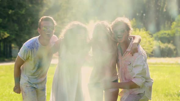 Smiling Students Enjoying Outdoor Party Hugging and Greeting Each Other