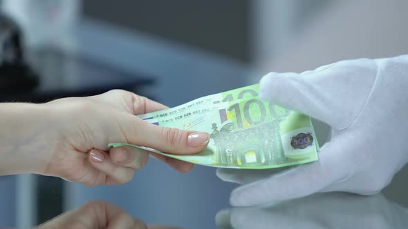 Female Giving Euro Bills to Administrator and Taking Key From Apartment, Horeca