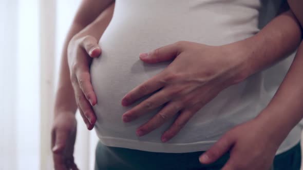 Pregnant Couple Feels Love and Relax at Home