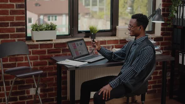 Business Man Using Mobile Phone to Chat on Remote Video Call