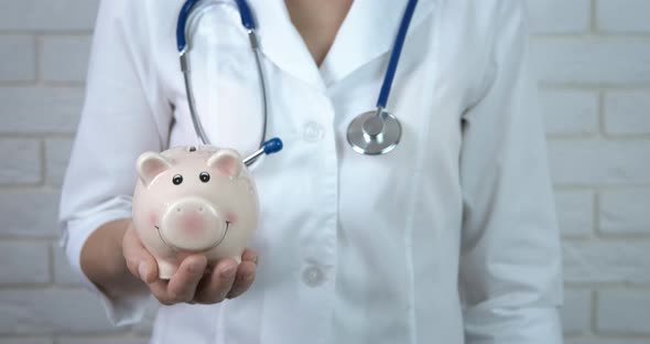 Doctor with Piggy Bank