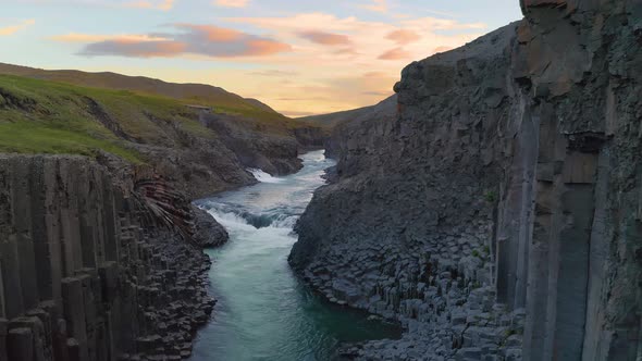 Flying Through the Studlagil Canyon in East Iceland at Sunset