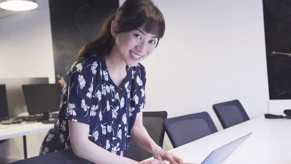 Woman using laptop in office