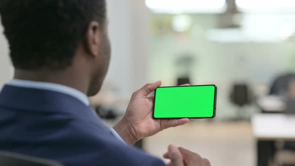 Businessman Watching Smartphone with Chroma Screen