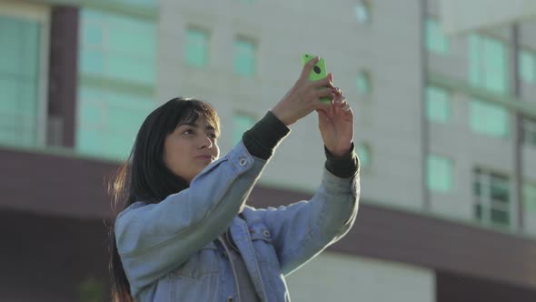 Cheerful Teen Girl Taking Selfie with Smartphone