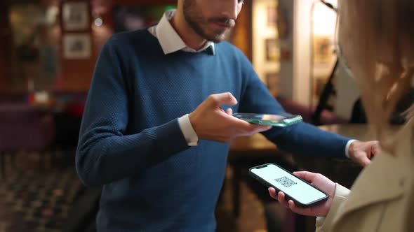 Access Mode During a Pandemic Restaurant Worker Scans Visitors Barcodes for Access to Restaurant